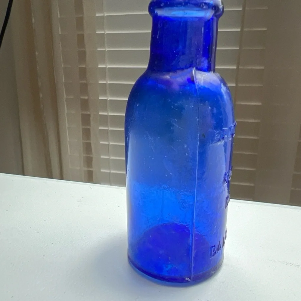 Lot of 4 vintage Colbalt Blue Glass Bottles